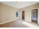 Bedroom with carpet flooring, walk-in closet, and a window with a view of the outdoors at 18720 Lake Dr, Monument, CO 80132