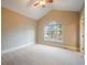 Bright bedroom with vaulted ceiling, neutral walls, and a large window letting in natural light at 18720 Lake Dr, Monument, CO 80132