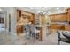 Stunning kitchen with custom cabinets, large island with seating, and professional-grade stainless steel appliances at 18720 Lake Dr, Monument, CO 80132