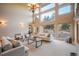 Bright living room featuring a high ceiling and a view of the exterior at 18720 Lake Dr, Monument, CO 80132