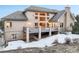 Exterior view of the rear of the property with large deck at 18720 Lake Dr, Monument, CO 80132