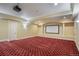 View of a theater room with tiered seating and projector screen at 18720 Lake Dr, Monument, CO 80132