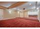 View of a theater room with tiered seating and a wet bar at 18720 Lake Dr, Monument, CO 80132