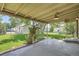 Back porch and serene backyard with lush greenery, providing a peaceful outdoor retreat at 1140 S Xavier St, Denver, CO 80219