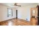 This neutral bedroom offers hardwood floors, ceiling fan, closet, and bathroom access at 1140 S Xavier St, Denver, CO 80219