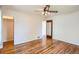 Spacious bedroom with beautiful hardwood floors and multiple doorways at 1140 S Xavier St, Denver, CO 80219