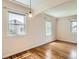 Sunny bedroom with hardwood floors and a classic archway ceiling at 1140 S Xavier St, Denver, CO 80219