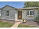 Charming home featuring a well-maintained lawn and inviting curb appeal at 1140 S Xavier St, Denver, CO 80219