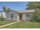 Charming home featuring a well-maintained lawn and inviting curb appeal at 1140 S Xavier St, Denver, CO 80219