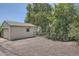 Exterior view of the side of the detached garage with a parking area at 1140 S Xavier St, Denver, CO 80219