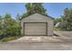 Spacious detached garage offering ample parking or storage space with mature trees around the back at 1140 S Xavier St, Denver, CO 80219