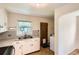 Functional kitchen with stainless steel sink and vintage tile flooring at 1140 S Xavier St, Denver, CO 80219