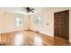 Bright living room features hardwood floors and plentiful natural light at 1140 S Xavier St, Denver, CO 80219