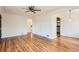 Spacious living room featuring beautiful hardwood floors and archway details at 1140 S Xavier St, Denver, CO 80219