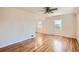 Bright living room featuring hardwood floors and natural light from plentiful windows at 1140 S Xavier St, Denver, CO 80219