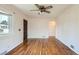 Bright living room featuring hardwood floors, ceiling fan, and natural light at 1140 S Xavier St, Denver, CO 80219