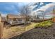Backyard with a small deck, wood fence, and sunny exposure at 965 W 96Th Ave, Thornton, CO 80260