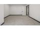 Large open basement area with gray carpet, white walls, and a door, perfect for finishing at 965 W 96Th Ave, Thornton, CO 80260