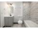 Modern bathroom with marble tiled shower and updated vanity offers a spa-like experience at 965 W 96Th Ave, Thornton, CO 80260