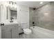 Modern bathroom with gray tiled shower-tub, and gray vanity with new fixtures at 965 W 96Th Ave, Thornton, CO 80260