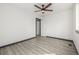 Bright bedroom features modern ceiling fan and sleek gray-toned flooring for a contemporary look at 965 W 96Th Ave, Thornton, CO 80260