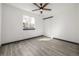 This bedroom features modern flooring, one window, a ceiling fan and a closet at 965 W 96Th Ave, Thornton, CO 80260
