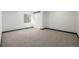 Bedroom with soft neutral carpet and window with natural light, featuring a double door closet at 965 W 96Th Ave, Thornton, CO 80260