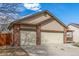 Charming home featuring a well-manicured lawn, front porch, and a convenient two-car garage at 965 W 96Th Ave, Thornton, CO 80260