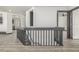 Hallway featuring sleek floors and modern design, leading to various areas of the home at 965 W 96Th Ave, Thornton, CO 80260