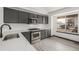 A modern kitchen with stainless steel appliances, granite countertops, and sleek cabinetry at 965 W 96Th Ave, Thornton, CO 80260