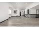 A spacious living room featuring new flooring, white wall color, staircase and natural light at 965 W 96Th Ave, Thornton, CO 80260