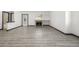 A spacious living room featuring new flooring and a fireplace with white wall color at 965 W 96Th Ave, Thornton, CO 80260