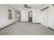 A primary bedroom featuring plush carpeting, a ceiling fan, and bathroom access through a doorway at 965 W 96Th Ave, Thornton, CO 80260
