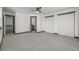 Spacious main bedroom featuring plush carpeting, a ceiling fan, dual closets and ensuite bathroom access at 965 W 96Th Ave, Thornton, CO 80260