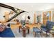 Bright living area featuring hardwood floors, modern staircase, and comfortable seating at 2937 Champa St # A, Denver, CO 80205