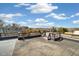 City view from this rooftop deck with wooden railings showcasing rooftops and city buildings at 2937 Champa St # A, Denver, CO 80205
