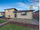 Charming home featuring a brick exterior, a cozy porch, and well-maintained landscaping, adding curb appeal at 3530 Dahlia St, Denver, CO 80207