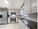 Modern kitchen with stainless steel appliances, sleek countertops, and ample cabinet space for culinary enthusiasts at 3530 Dahlia St, Denver, CO 80207