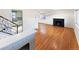 Bright living room with hardwood floors, a fireplace, and an open floor plan at 3530 Dahlia St, Denver, CO 80207
