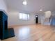 Inviting living room showcasing hardwood floors, a fireplace, and abundant natural light at 3530 Dahlia St, Denver, CO 80207