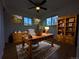 Inviting home office featuring a wooden desk, built-in bookcase, and charming decor at 3530 Dahlia St, Denver, CO 80207