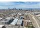 Wide aerial shot showcasing the Denver skyline and surrounding urban landscape at 3195 Blake St # 106, Denver, CO 80205
