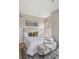 Calm bedroom space with bright light, accent wall art, and minimal decor at 3195 Blake St # 106, Denver, CO 80205