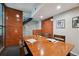 Spacious conference room with a large wooden table and statement wall at 3195 Blake St # 106, Denver, CO 80205