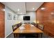 Conference room featuring a large wooden table, statement wall and ample seating at 3195 Blake St # 106, Denver, CO 80205