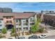 Multi-story condo building boasting a modern facade and well-maintained landscaping at 3195 Blake St # 106, Denver, CO 80205