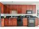 Functional kitchen offers ample counter space and dark wood cabinets at 3195 Blake St # 106, Denver, CO 80205