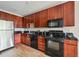 This streamlined kitchen features dark countertops and bright wood floors at 3195 Blake St # 106, Denver, CO 80205