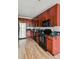 Well-equipped kitchen featuring stainless steel appliances and dark granite countertops at 3195 Blake St # 106, Denver, CO 80205