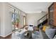 Bright living room with a staircase, sliding glass doors, and contemporary furnishings at 3195 Blake St # 106, Denver, CO 80205